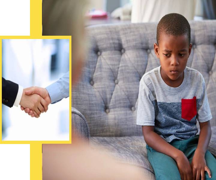 A man shaking hands with another person on the couch.